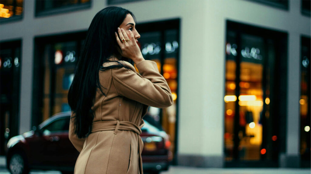 woman on the phone in a busy street